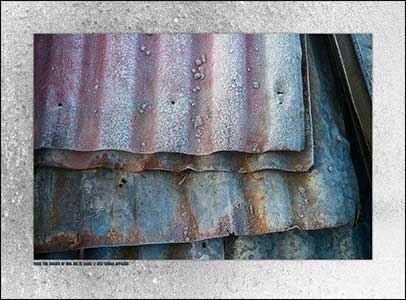 Sheets of corrugated iron covered in frost.