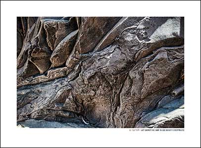 Distorted and varied brown rock surface.