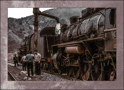 Steam locomotives and chatting crew.